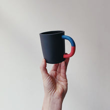 Load image into Gallery viewer, Black mug with blue/red handle
