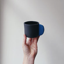 Load image into Gallery viewer, Black mug with blue handle
